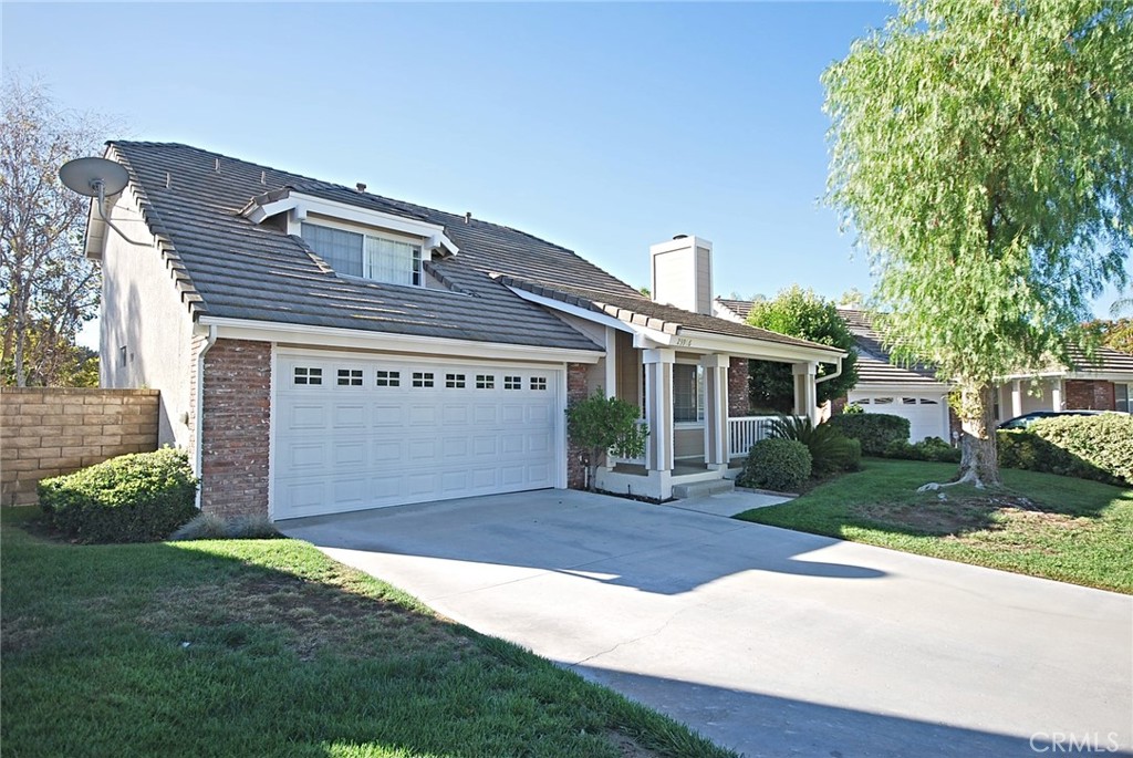 Beautifully Maintained Northbridge Home in the Heart of Valencia. Located on a quiet cul-de-sac, this charming 3-bedroom, 3-bathroom home with a bonus room offers a bright and open floor plan with soaring ceilings in the living room. The spacious dining room seamlessly flows into the kitchen, which features a brand new stainless steel oven and microwave. Enjoy stylish laminated hardwood flooring downstairs, new carpet upstairs, and fresh interior paint throughout. A convenient downstairs bedroom and full bathroom make this home ideal for guests or multi-generational living. Upstairs, you'll find additional bedrooms, a versatile bonus room, and well-appointed bathrooms. Do not miss the huge backyard with covered patio and privacy for the family activities. Community highlights include access to an Olympic-size pool, relaxing spa, scenic trails, and a nearby park. Located close to a top-rated, Blue Ribbon Award-winning elementary school, this home offers both comfort and convenience. Don't miss this wonderful opportunity to live in one of Valencia’s most desirable neighborhoods!