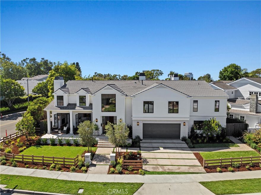 Discover a stunning re-imagined 2024 custom single-family residence nestled in the serene neighborhood of the Port Streets. Located on a spacious corner lot spanning 9,000 sqft, the home offers a tranquil retreat with 5,306 sqft of living space. No expense has been spared in sourcing the finest finishes. White French oak floors flow throughout the home. The inviting living room features French doors that open onto the front porch, allowing for afternoon breezes and easy access to outdoor entertaining; a cozy stone fireplace also provides warmth and ambiance in this formal space. The gourmet kitchen is a chef's dream, featuring a Wolf six burner range, Sub-Zero refrigerator, 2 Bosch dishwashers, wine refrigerator, Wolf cappuccino maker, dual islands, Taj Mahal quartzite countertops, and gorgeous pendant lighting. Enjoy casual dining with bar seating or gather in the formal dining area for a more sophisticated entertaining experience. The family room off the kitchen is complete with bifold doors that lead to the back patio for indoor-outdoor living. The backyard offers a lush green grassy area that creates a serene and peaceful atmosphere, making it the perfect space for entertaining guests or simply unwinding. The dedicated work-from-home office with French doors offers a private and productive workspace. A secluded main floor guest bedroom with en-suite bathroom, walk-in shower, and views of the front yard is perfect for accommodating visitors or extended family. The second floor, primary suite is a luxurious retreat, featuring a soaking tub, dual-head showers, dual vanities, Calcutta black marble countertops, white oak finished cabinetry, his-and-her closets with built-ins, washer and dryer, and a private balcony. Three additional bedrooms and 2 bathrooms are also located upstairs, creating an ideal separate wing. Ensuring convenience and functionality, the second level also includes a laundry room complete with utility sink. Additional home features include recessed lighting and prewiring throughout for your premier entertainment system, as well as a two-car attached garage. The award-winning Blue Ribbon school, Andersen Elementary, serves the community. The home is also located within moments of exquisite dining and shopping options at Fashion Island. This exceptional home offers the perfect combination of style, comfort, and functionality.