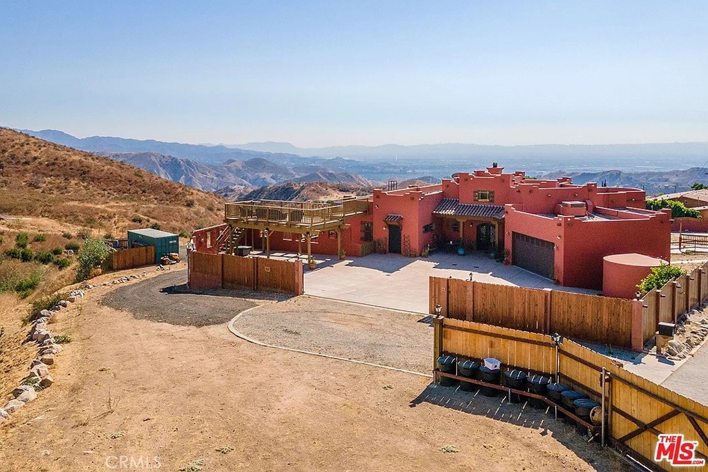 Tucked away in the peaceful community of Sylmar, this one-of-a-kind 3-bedroom, 2.5-bathroom home offers 2,127 sq. ft. of inviting living space with soaring ceilings, an open floor plan, and an abundance of natural light. Designed with unique character and customized interior details built specifically for the current owners, this property stands apart as truly special.
The spacious kitchen boasts a large island, stainless steel appliances, and a charming breakfast nook, while the living areas seamlessly flow to expansive windows framing breathtaking mountain views. Each bedroom offers direct access to outdoor spaces, and the master suite is highlighted by bay windows overlooking the lush backyard, plus a luxurious en-suite with a soaking tub and oversized glass shower.
Multiple decks provide the perfect setting for entertaining or relaxing while taking in panoramic vistas—including unforgettable sunsets. An oversized garage adds exceptional flexibility with room for cars, storage, or even a workshop.
With its modern comforts, custom design, and unmatched views, this Sylmar retreat is a rare gem you won’t want to miss!