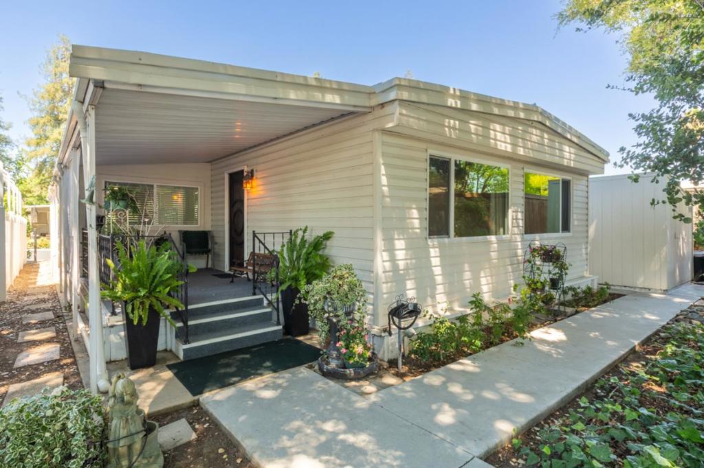 This is the one you've been waiting for! Coveted greenbelt location in the sought-after Paseo de Palomas RESIDENT OWNED park! Beautiful 1320 sf mobile home with an add'l 160 sf (approx) family rm. So many thoughtful updates! New interior paint & carpet. Durable LVP flooring in high traffic areas. Textured walls & ceilings, dual-pane windows, skylights for natural light, tankless water heater, newer central a/c, newer roof coating, lovely remodeled bath. The neutral kitchen features a double oven, gas stove, pull-out shelving & a breakfast bar. The spacious living/dining room offers views of the tree-lined paseo. Enjoy a soaking tub & walk-in closet in the large primary suite. A convenient wheelchair lift is thoughtfully located where it won't block the driveway. Extended carport posts allow extra room for car doors. The large Tuff Shed offers a workbench & extra storage. Resident owned = peace of mind, as you control the land, not a landlord or developer! This popular SENIOR park offers a pool, spa, sauna, bocce ball, clubhouse, many social activities. Enjoy nearby Pruneyard & Downtown Campbell for shopping, dining, and all the awesome local events. Park approval required. 1 person must be age 55+, all other occupants age 45+. $15k one-time fee to buy into the community.
