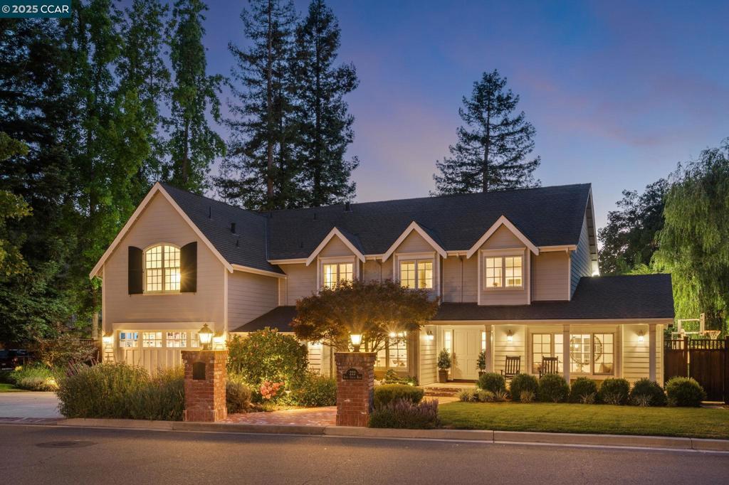 Completely remodeled with comfortable elegance throughout, this stunning home features a charming craftsman-style exterior with a welcoming front porch and dormer windows. Inside, the spacious living and dining rooms boast large picture windows, custom built-ins, and designer chandeliers. The expanded kitchen and family room are the heart of the home—highlighted by custom cabinetry, Sub-Zero fridge, Wolf range, oversized island with seating, huge pantry, and views of the spectacular backyard. The family room is open and inviting with a classic fireplace and sliders leading out. The backyard is an entertainer’s paradise with a covered patio, full outdoor kitchen, sparkling pool, pool house, firepit, and bocce court—all backing to a private wooded area on a ½-acre lot. First-floor bedroom/office, designer full bath with backyard access, and upstairs bedrooms that rival a 5 Star Luxury Hotel. The primary suite impresses with a dream closet (every woman's dream come true), spa-like bath, and custom cabinetry throughout. Every detail is beautifully curated for both style and comfort—this home truly has it all! With Top Ranking Schools and darling downtown Danville at your fingertips, this home is truly a "10"!