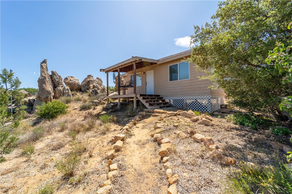 Absolutely spectacular and stunning 40 acre high desert retreat property bordering Anza Borrego Desert State Park in Anza. These two lots totaling 40 acres have a fully functional water well (well drilling report available) and electric meter along with a 1 bedroom cabin that is turn-key. These lots are adjacent to the Pacific Crest Trail and State Park Land. Come be a trail angel and provide food and showers for hikers?? There are Zero homes in view and you are absolutely in the Wilderness on this property. At the same time the access is decent and not that far from paved road. There are several usable areas of the lot with water piped to multiple areas on the lot. The views are Amazing of the Anza Borrego park from the cabin along with multiple mountain ranges and valley views. Wildlife and high desert fauna and beautiful boulders abound. There are even some oak trees on the property. Regular viewings of deer, bobcats and coyotes abound on this property. There is a dry pond which if restored would only increase wildlife on the property. This property is behind locked gates and under 24 hour surveillance. You must contact listing agent or have your buyers agent contact listing agent prior to going to or viewing the property. Directions to property: Terwilliger to Coyote Canyon @ End L Yucca Valley R Sunset Sage R Jimson L Table Mountain R Old Cattle on L is Bear Track Ct.