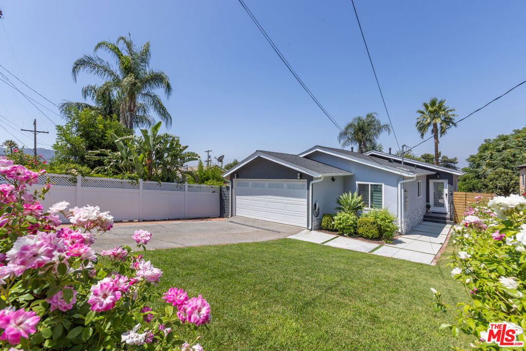 Welcome to your dream home at 10315 Fairgrove Avenue in Tujunga, CA. This charming single-family residence, built in 1961, offers a cozy yet spacious living environment with its 1,148 square feet of thoughtfully designed space. The home boasts 3 bedrooms and 2 bathrooms, plus a 244sf garage conversion, making it ideal for anyone seeking comfort and functionality. Step inside to discover an inviting open floor plan that enhances the sense of space and connectivity throughout the home. The living areas are adorned with sleek laminate flooring, offering both durability and style. The modern kitchen is a culinary enthusiast's delight, featuring elegant quartz countertops that provide ample space for meal preparation and entertaining. Stay comfortable year-round with central HVAC, ensuring a perfect climate in every season. The highlight of this property is the expansive backyard with a jacuzzi, ideal for outdoor gatherings and relaxation. Enjoy the convenience of a patio/deck area, enhanced by an electric awning that provides shade and comfort for your outdoor activities. In addition to the main living spaces, this home offers a separate attic storage area and under-deck storage, ensuring you have plenty of room for all your belongings. Situated on a generous 4,599 square foot lot, this property offers a perfect blend of indoor and outdoor living in a serene neighborhood. Tesla charger included. This home is a true gem, offering a unique opportunity to experience the best of Tujunga living.