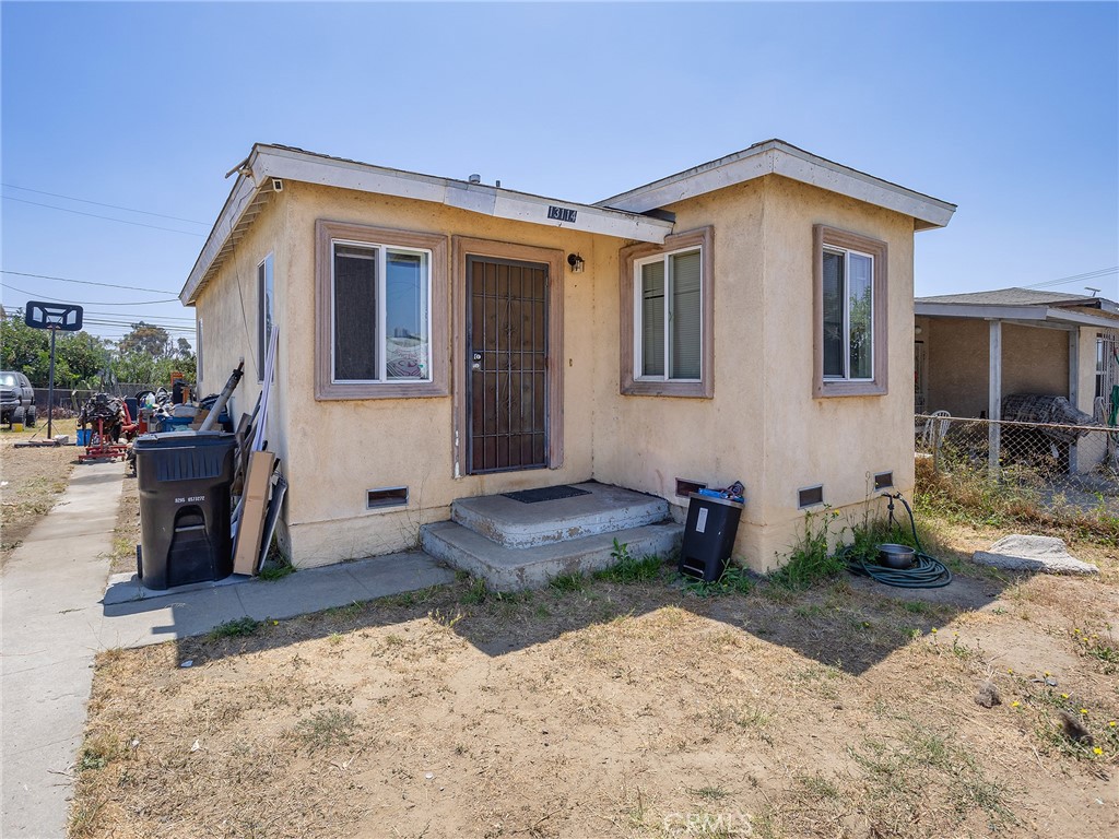 Nestled on a 2,950 square foot lot, this charming 674 square foot home offers a smart opportunity for first-time buyers or investors looking for potential. With two comfortable bedrooms and one full bathroom, the layout is both efficient and inviting. The home features Pergo flooring throughout, adding a warm and modern touch. A cozy kitchen with an adjoining dining area creates a practical space for everyday meals or casual entertaining. You'll also find a dedicated laundry area for added convenience. Outside, the property offers a generous backyard with alley access, perfect for creating your own outdoor retreat or expanding future possibilities. There's also ample room for RV parking. Gas heating keeps the interior cozy during cooler months, and the overall footprint of the lot makes it easy to maintain while still offering plenty of functional outdoor space. Whether you're starting out or building your real estate portfolio, this is a solid choice with great potential.