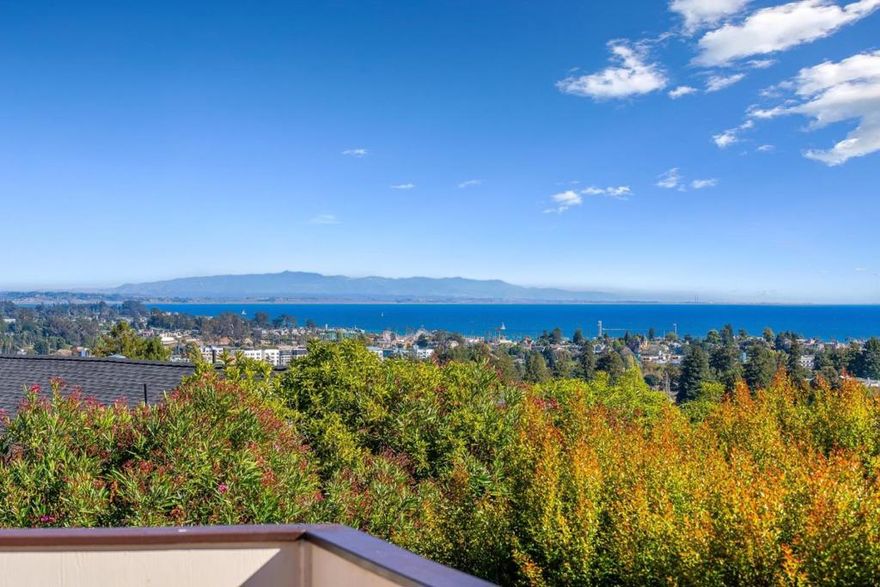 Perched on Santa Cruzs coveted Upper Westside, this exceptional home captures stunning sunrise vistas over Monterey Bay, as well as mesmerizing nighttime views of the city, Santa Cruz Boardwalk, and Wharf. Featuring 4 bedrooms plus an office/library, the versatile floor plan offers multiple inviting spaces for both relaxation and entertaining  including a living room, formal and informal dining areas, and a grand great room with high ceilings, a fireplace, wet bar, and expansive ocean-view windows opening to a spacious deck. The primary suite is a serene retreat with a fireplace, generous walk-in closet, built-in dresser, ample storage, and a large ensuite bath opening to a private ocean-view balcony. Enjoy outdoor living across multiple decks and a fenced backyard oasis, perfect for gatherings or moments surrounded by nature. Conveniently located near UCSC, local schools, Westlake Park, scenic hiking and biking trails, downtown shops, fine restaurants, and the beach, this home balances tranquility with accessibility. Some of the recent updates include a newer roof, fresh interior and exterior paint, new flooring, updated lighting and hardware, new windows (currently being installed), and a newly reimagined front yard.