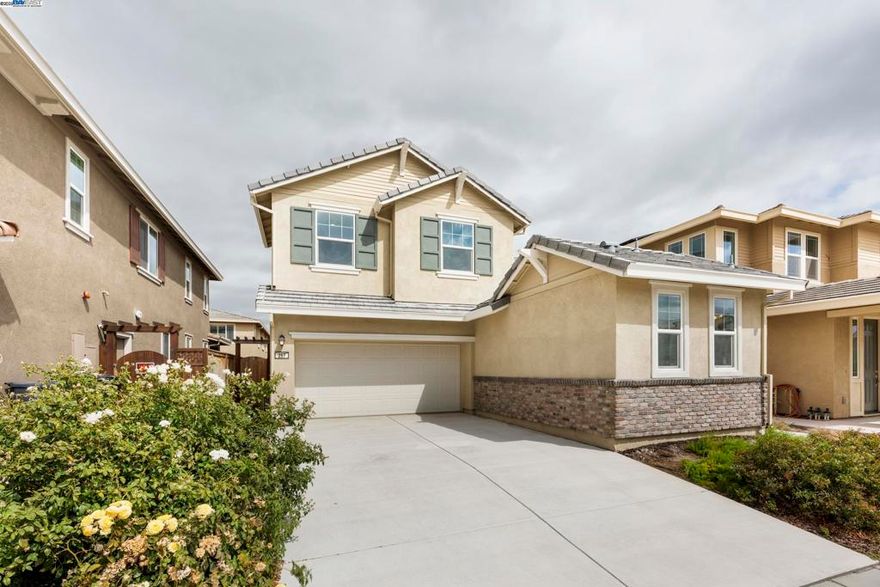 TRANSPARENT PRICING! Major Price Improvement for Buyer's Instant Gain! Fantastic 4BD/3.5BA, 2,125 sq. ft. in the highly desirable & fast-growing Mountain House! ~ $30K Owned Solar Panels. No HOA! This stunningly beautiful two-story home features an openly bright & airy floor plan, with plenty of space for entertaining. Step inside and be greeted by a charming covered front porch, leading you into a spacious great room with soaring 9-foot ceilings. The main floor flows seamlessly into a gourmet kitchen equipped with stainless steel appliances, ample cabinetry, and a walk-in pantry. ALL appliances stay! Upstairs, you’ll find three bedrooms, including a luxurious primary suite with an en-suite bathroom, a versatile family room/den & a convenient laundry room. The attached casita/in-law unit offers a private entrance, providing excellent flexibility for guests or potential rental income. The two-car smart garage includes an EV charger and plenty of space for parking or storage, with additional parking available on the long driveway. Enjoy the convenience of being minutes away from Top-rated schools, major shopping centers like Costco and Safeway, and easy access to Freeways 580 & 205. Low-maintenance front and back yards make this home as practical as it is beautiful. MUST See!!