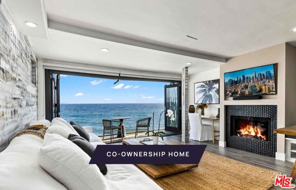 New Co-Ownership Opportunity: Own one-eighth of this turnkey home, professionally managed by Pacaso. The Pacific is front and center in this contemporary oceanfront home that maximizes the views and beach lifestyle. The living space features a dining area with banquette seating, a brick fireplace and bi-fold French doors that open to a cozy covered deck. The kitchen has stainless steel appliances, a double-drawer dishwasher and access to the 2-car garage. Skylights bring warm shafts of light throughout the second floor. The zen-like primary bedroom features bi-fold doors to a private balcony overlooking the ocean, a modern fireplace and an en suite bathroom with soaking tub, dual-sink vanity and a marble tiled shower. Another bedroom and a bunk room ensure there's plenty of room for guests. Below the main floor, the nearly 1,000-square-foot foot deck has been transformed into an entertainment haven, featuring a tiki bar, dining table, chair swings and a motorized, waterproof door. The home comes fully furnished and professionally decorated.