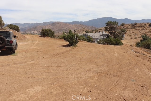 Easy access 5 acre view lot. Lot offers a panoramic view of downtown Acton and Parker Mountain. Partially graded. Smooth dirt road access. Great opportunity to own a great piece of land with the potential to build your dream home. Zoned for animals. Zoned A21. Possibility of county water supply. Buyer to verify. Come for a visit. Stay for a lifetime. Welcome Home!