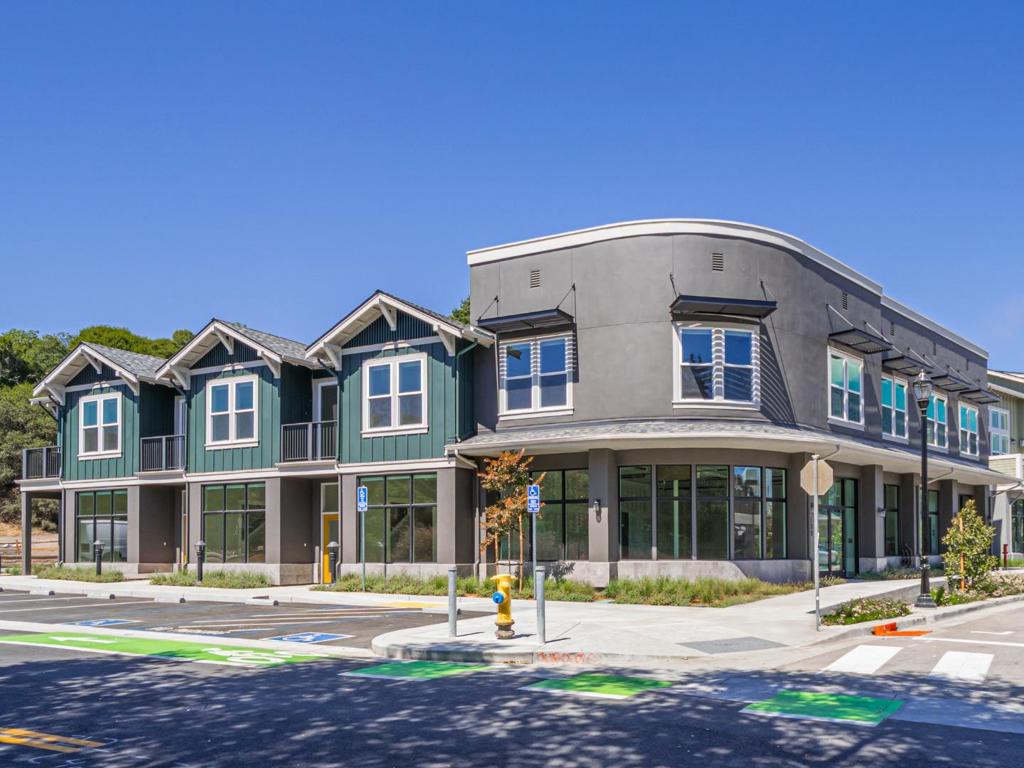 Experience modern coastal living in this unique Live-Work Luxury Condo in the heart of the Aptos Village. This rare Live-Work unit is one of only 3 units available which feature a street-level commercial space/retail entrance with private residential space above. This offers unmatched flexibility for entrepreneurs, creatives, or those seeking a dynamic work-from-home lifestyle. Designed with two spacious primary suites, the home boasts high ceilings, abundant natural light, and designer-selected finishes throughout. The open-concept live-work space flows into a sleek kitchen, while the upstairs bedrooms provide privacy and comfort. Enjoy walkable access to local dining, shopping, and the entrance to The Forest of Nisene Marks, offering over 30 miles of hiking and biking trails. With secure parking, energy-efficient systems, and all the benefits of new construction, this is a rare opportunity to live and work in one of Santa Cruz County's most desirable new community.
