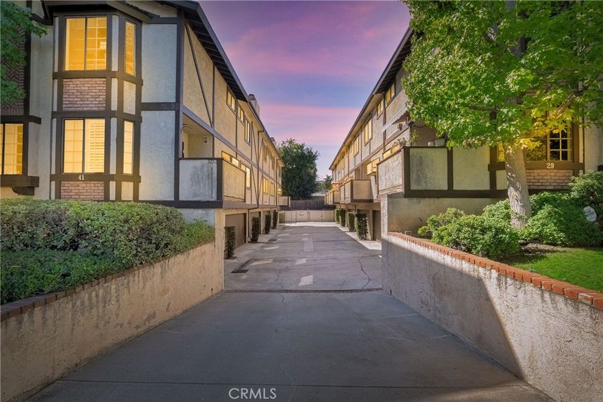Wonderful Tudor Townhome in Prime Pasadena Location! Walk to the Rose Parade! Beautifully updated 2-bedroom, 2.5-bath Tudor-style townhome in a small, well-maintained complex of only 11 units. Each bedroom has its own full bath. The primary suite features cathedral ceilings, a spacious walk-in closet, and a lovely view of the San Gabriel Mountains. Recent upgrades include new kitchen countertops, laminate flooring in the kitchen and both bedrooms, and recessed lighting in the kitchen and living room. The bright living room features hardwood floors, a cozy fireplace, and a dining area with a new chandelier that opens to a private terrace. The kitchen offers wood cabinets with stainless steel pulls and a charming garden window that fills the space with natural light. A powder room is conveniently located on the main level. Additional highlights include an attached 2-car garage with direct access, a large laundry/storage room with shelving, and all appliances included. The Tudor-style complex offers a spa and BBQ area, perfect for relaxation and entertaining. HOA covers water, trash, roof repairs/maintenance, termites treatment and repairs, exterior painting, Perfect for first-time home buyers or investors! Conveniently located near Downtown Pasadena, shops, restaurants, Caltech, and PCC. Don’t miss this opportunity — it won’t last long on the market!