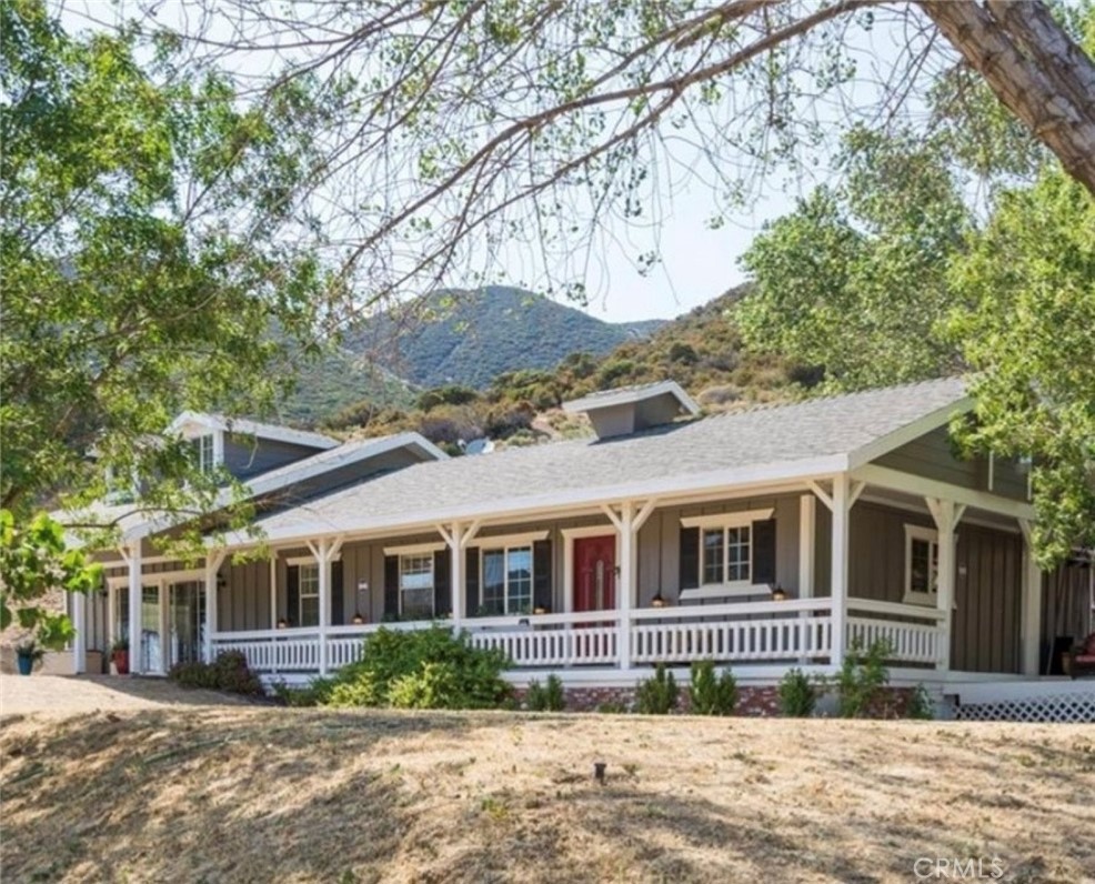 Nestled on over 12 acres of private land in the picturesque Green Valley, lies a stunning property boasting a myriad of enticing features. Surrounded by majestic mountains, this property includes a large detached 4-car garage, convenient storage sheds, and a charming home with 3 bedrooms and 2 bathrooms. Offering a spacious 1,728-SqFt floorplan, the home welcomes you with a delightful front porch. Prepare delightful meals in the well-appointed kitchen, complete with elegant tile countertops, beautiful wood cabinets, built-in appliances, and a convenient center island with room for bar stool seating. The home also includes a practical laundry room, featuring ample storage space and a tiled countertop perfect for folding your laundry with ease. The potential for this property is limitless. The second level has a bedroom. Situated near the scenic Lake Elizabeth, enchanting hiking trails, a local market, a gas station, and more, the location offers both tranquility and convenience. Embrace the opportunity to experience the best of Green Valley living in this idyllic retreat.
