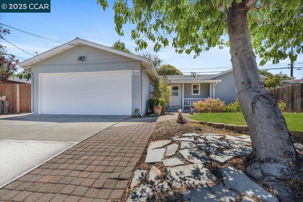 This well-maintained 1,131 sq ft single-family home offers 3 bedrooms and 2 baths on a generous 7,000 sq ft lot. The kitchen features crisp white cabinetry, a peninsula with bar seating, and gas cooking—perfect for casual meals or entertaining. The living room boasts hardwood floors, recessed lighting, and a brick fireplace, creating a warm, inviting atmosphere. The bedrooms are filled with natural light and showcase classic wood flooring. Outside, enjoy a covered patio and low-maintenance turf lawn—ideal for relaxing or hosting gatherings. Additional highlights include a two-car attached garage, forced-air heating, and central cooling for year-round comfort. Located within approximately half a mile of Highlands Elementary School and close to local parks and shopping.