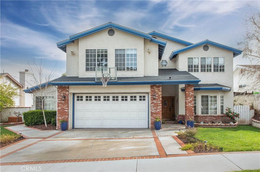 Excellent Opportunity - Spacious home in the heart of Saugus with the most amazing views in the area for lease!  4 bedrooms with an oversized bonus room perfect for use as a 5th bedroom, game room or additional living room.  Downstairs has vaulted ceilings, formal dining room, step down living room and family room and open dine in kitchen, along with a guest bedroom with it's own separate entrance.  Updated kitchen has light granite countertops, counter hight breakfast bar, drop in sink, subway tile backsplash, stainless appliances, hood, microwave and wine fridge.  Connected family room has cozy brick fireplace, updated windows for plenty of natural lighting throughout.  Primary bedroom has a balcony to enjoy your morning coffee or sunset night cap, his and her closets, large jetted soaking tub, and separate block shower.  The yard is a wonderful spot for a soak in the jacuzzi, enjoying the 180 degree view of the mountains, city and Central Park. Low utilities come from upgraded insulation and use of the whole house fan. Also enjoy the whole house water softer and EV plug in the garage.  Top it all off with unmatched walkability has you close to the area schools, multiple restaurants, grocery and convenience stores, ice cream shops, gym, and of course the outside gem of Santa Clarita Central Park!  Semi furnished if you'd like - ready for you to move right in.