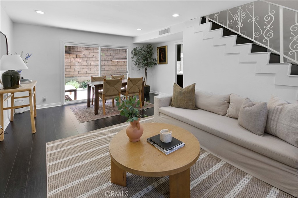 Welcome to this move-in ready townhome in the highly sought-after community of Agoura Hills. This 3-bedroom, 2.5-bathroom home features an attached two-car garage and is located within the award-winning Las Virgenes School District.
Step into the bright and airy living room, complete with a gas fireplace perfect for cozy nights. The open floor plan flows effortlessly into the dining area and updated kitchen, which boasts quartz countertops, stainless steel appliances, and a walk-in pantry. Sliding glass doors from both the kitchen and living room lead to a newly landscaped, private back patio—ideal for outdoor dining and entertaining. A second patio in the front creates the perfect spot for morning coffee or catching up with neighbors.
Upstairs, the spacious primary suite offers two walk-in closets and an en suite bathroom. The two additional bedrooms are generously sized with plenty of closet space. Additional highlights include LED lighting, newer A/C, smart storage solutions on both levels, and a well-maintained community setting.
Enjoy the best of Agoura Hills living—just moments from top-rated schools, parks, shops, and scenic hiking and equestrian trails at Chesebro Canyon. Don’t miss your chance to make this turn-key home yours. Seller to pay special assessment in its entirety at close of escrow.