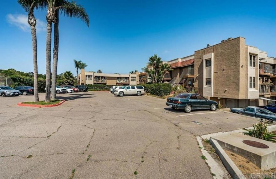 Back on the market - no fault of seller. This well-kept home sits in a prime National City location, just steps from Las Palmas Park. An entrance from parking lot takes you straight to the park that offers a public pool, little league baseball fields, dog park, tennis courts, and a recreation center - perfect for active lifestyles and family fun. Love to Golf? You'll also be close to a scenic nine-hole course for a quick round any day of the week. This updated 2 bed/2 bath home offers the lower level corner unit with a fenced patio and another space at the front door to make it your own private little sitting nook. Just minutes to freeway entrances, with shopping, dining, and everyday conveniences close by.