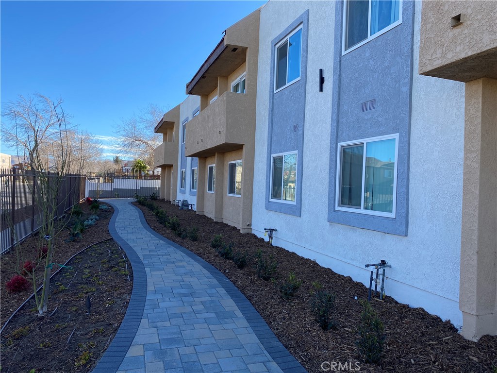 Features include a fully secure and gated building. Remodeled kitchen features stainless steel appliances, soft close cabinets with plenty of storage.
Covered parking, indoor laundry hook up inside each unit and individual central air and heat. Location features close proximity to Palmdale Regional Medial Center, Palmdale Transit Village, Antelope Valley Mall and the Palmdale Civic Center. Walking distance to Metrolink station.