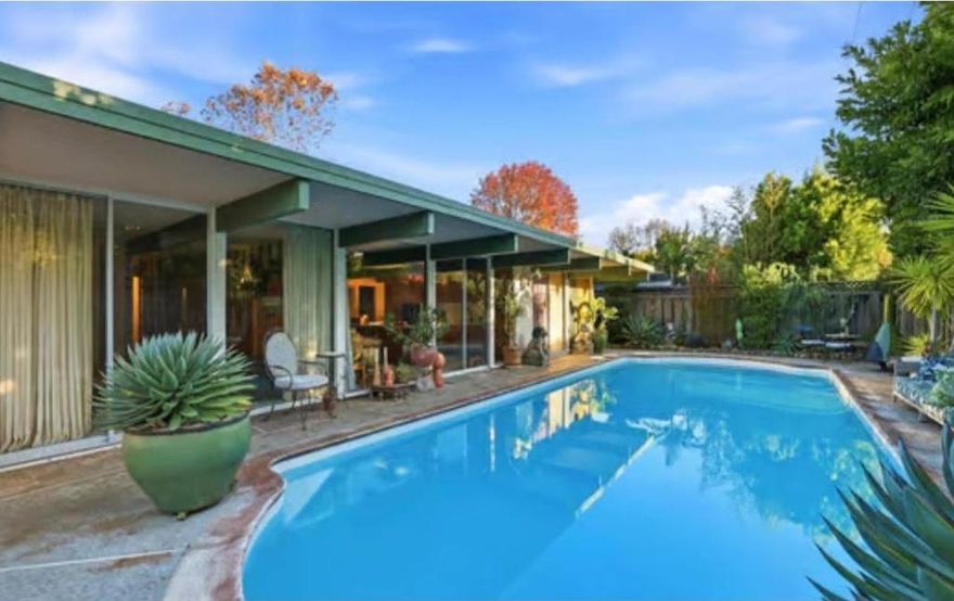 Eichlers attract artists of all kinds. Designed by interior designer Lisa Holleran, she defines Mid-Century Modern Maximalism with this truly special and unique Eichler located in the heart of Fairglen. The open layout centers around a spacious living room with high ceilings, flowing seamlessly into the dining area and completely upgraded kitchen. Walls of glass fill the home with natural light, creating an ideal setting for both entertaining and everyday living. Additional features include four bedrooms plus an office, completely upgraded bathrooms, a large separate family room with a fireplace, low-maintenance drought-tolerant landscaping, a zen-like resurfaced pool, newer roof, and an attached two-car garage. Located in a fantastic neighborhood known for its community block parties. Conveniently located only a few minutes away from dining, shopping, parks, and schools. Enjoy all that Willow Glen has to offer!