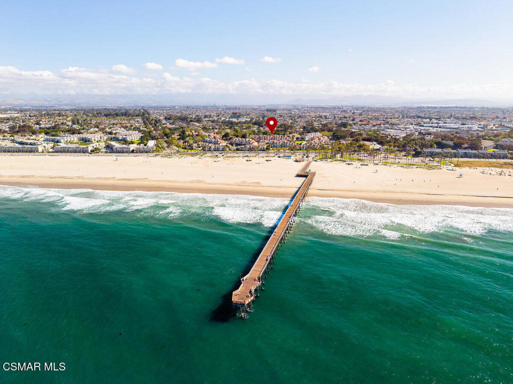 Live the Coastal Dream- Every Day 🌊Must See - Ocean Front property meets Upscale Living!Enjoy a Peek-a Boo View of the Ocean.Keyless entry with code or finger print. Beautifully remodeled Kitchen: New wood cabinets, custom counter tops, warm wood island with elegant lighting. New smart LG stove with airfryer. New waterproof concrete infused Vinyl flooring through out. Open Concept flows beautifully from Kitchen, Dining, Living spaces, illuminated with thoughtfully placed recessed ambient light. Convenient hallway includes Laundry and cabinet storage.Step into-inspired luxury bathrooms: clean lines, sleek finishes, enjoy a deep soak in the main bathroom tub.Your Main room has floating nightstands, stunning custom accent wall, sliding glass doors leading to your private outdoor sanctuary. This expansive south facing patio spans over 500 square feet, offering all-day sun and seamless-outdoor living. Perfect for entertaining with dedicated space for BBQ and Bar, ideal for sunset gathering or starlit soirees.An overhang portion of the patio provides shade and comfort for peaceful morning coffee, or an evening unwind. Your new Beach Living is situated directly across from the Pelican Club. Pelican Club has 3 level Amenities: Level 1 Brand new indoor remodeled Pool and Spa opening July 15, 2025, with remodeled Bathroom and Dry Sauna. Level 2, remodeled bathrooms, 2 pool tables, Foosball, Ping Pong Table, Level 3, Aerobic room, Weight Room, Grand Piano, Kitchen, Library, Outdoor Patio with BBQ & Amazing Views of the Topa Topa Mountain Range.Enjoy a driveway to your single car garage with dramatic ceiling allowing for two loft areas for storage. Only a few of the garages have the opportunity for parking a car in front. Building M is 1 of only 6 buildings with an elevator out of 18 buildings on this 11 Acre Beautiful Estate.Joining the Surfside IV community is more than Beach Living, there is a Social Committee for Bingo & Parties, Tai Chi Class, Camp Fire on Hueneme Beach with Smores & musical entertainment.HOA includes Banquet Facility, Club House, Conference Room, Water, Sewer, Landscaping, Facility Maintenance, Earthquake Insurance. Maximum of two Pets are allowed.-Near By-Moranda Park:10 Pickleball Courts4 Tennis Counts4 Basketball Courts1 baseball field-Bubbling Springs Park: 800,000 book Library, Soccer Fields, Small Dog Park, Large Dog Park-Shops:Anacappaccino (Local)Antonio's, Pho, Acia Bowls,Subway,Pizza Man Dan,Wendy's, Animal Vet, -Post Office- Hueneme Light House-Port Hueneme Museum-Seabee Naval Golf Course Available to Public. - Hueneme Beach is a 'IHidden Treasure' found between **Los Angeles and Santa Barbara**