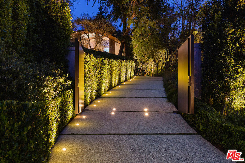 Introducing the Briarcrest Estate, the pinnacle of luxury living. This exceptional property stands as a testament to elegance in restraint. With its exquisite design, the home utilizes five primary materials; travertine, oak, cedar, bronze, and steel to create a harmonious blend that seamlessly integrates the home with its natural surroundings. The result is an organic, awe-inspiring masterpiece that captivates the senses. Set on a sprawling 1.3 acres, this extraordinary sanctuary boasts a wealth of amenities that deliver a resort-like environment, including; a 52-foot swimmers pool and a floodlit tennis court surrounded by whimsical, meandering gardens. Gated and private, garage parking for 5 cars and a separate guest house all situated moments away from the vibrant pulse of Beverly Hills, granting convenient access to the finest restaurants, bars, and boutiques that the city has to offer.