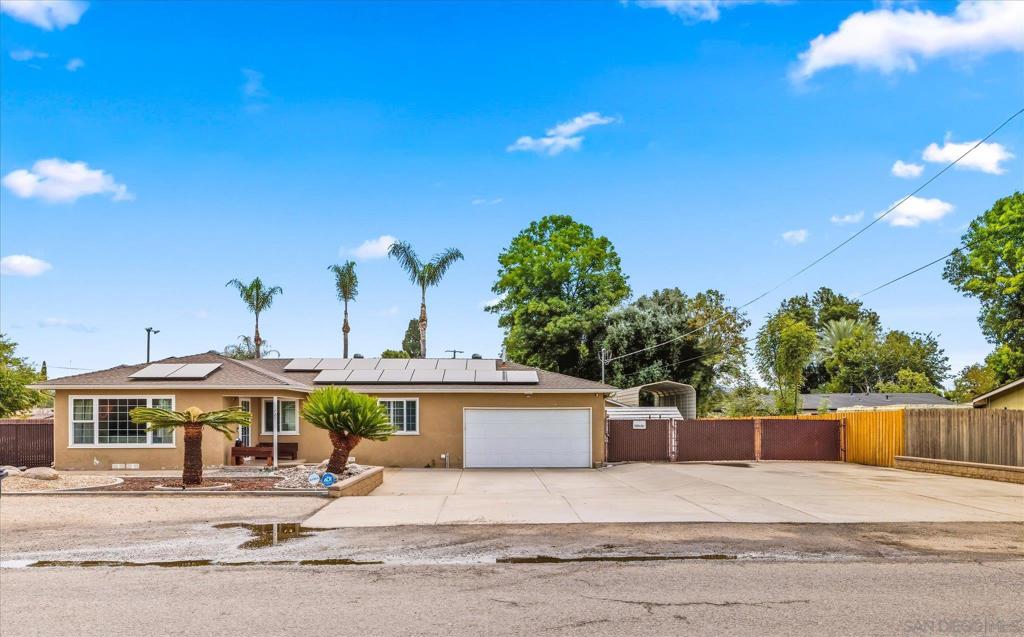 Welcome to this charming 3 bedroom, 1.5 bathroom single story home in the heart of Lakeside, offering 1,110 square feet of comfortable living space on a generous 0.35 Acre flat lot. This property has it all, an attached 2 car garage plus a separate detached 2 car garage, providing plenty of room for vehicles, storage, or even a workshop. Enjoy the benefits of solar panels for energy efficiency, along with RV parking and additional space for all your toys, equipment, or future projects. The expansive lot offers endless possibilities, from outdoor entertaining to gardening or even adding on. Conveniently located near schools, shopping, and freeways, this home combines functionality, versatility, and value!
