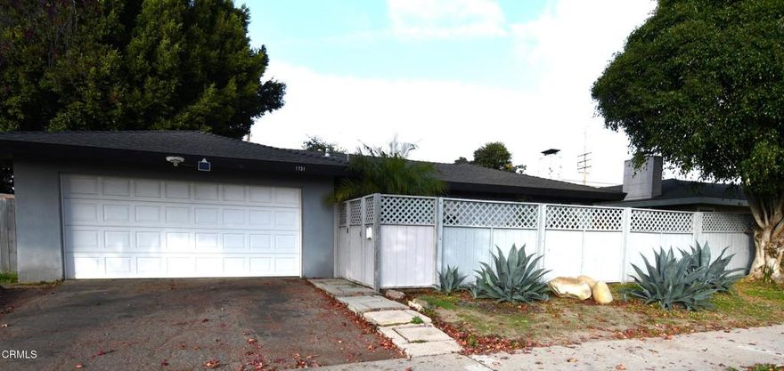 Here is your opportunity to own this spacious home located in desirable North Oxnard!  Walk into the cute, fenced-in private front patio ideal for having your morning coffee.  The freshly painted double door entry greets you into the spacious 1500+ sq foot home.   The minute you walk into this home you will appreciate the generous size living/family area with cozy fireplace which opens into the dining area.  Slider doors and large windows surround the dining area and lead to an atrium-style courtyard pefect for entertinaing.  The galley style kitchen has been updated and includes an electric stove, stainless steel sink, modern gray cabinets and woodlike floors.  The primary bedoom offers a double closet with tons of space and updated bath with modern black finishes.  The Jack and Jill second and third bedroom offers endless possibilites.  Keep them seperate to accomodate a larger family or open them up and you can have a secondary pirmary bedroom.   The double garage has direct access to the home and offers laundry hook ups.  In the back yard you will find 3 sheds for additional storage, fruit tree, new wood fence on both right and left sides.