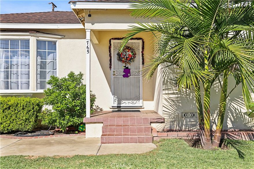 Welcome to this beautifully maintained 3-bedroom, 2-bath home nestled on a spacious corner lot in a prime location. The home features a wrought iron gate for additional privacy and security. Offering comfortable living space, this property blends classic charm with thoughtful upgrades — perfect for anyone seeking a move-in-ready home.

Step inside to an updated kitchen complete with an electrical upgrade.  Enjoy peace of mind with copper plumbing throughout, an upgraded electrical meter, and a remodeled bathroom and laundry room that bring a fresh and stylish touch to everyday living.

Outdoors, the home is equipped with a sprinkler and drip irrigation system that supports a lush variety of fruit trees including citrus, guava, and avocado — your own private orchard! The spacious corner lot also provides plenty of room for gardening, entertaining, or future possibilities.

Located just minutes from parks, schools, major freeways, and hospitals, this home offers convenience and accessibility for every lifestyle.