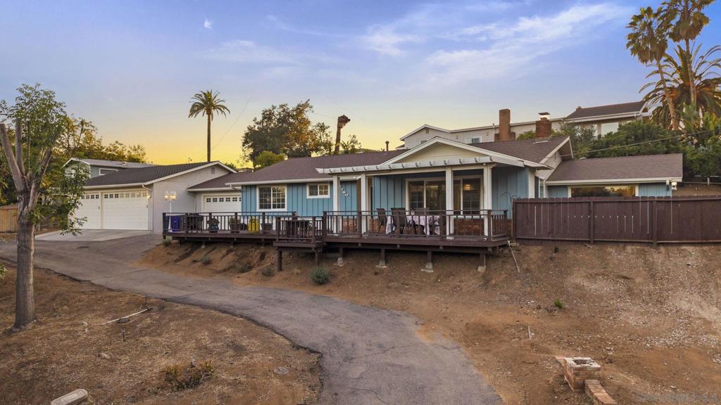 This beautifully updated single-level home in the desirable Rancho San Diego area of El Cajon offers a RARE FIVE-CAR garage setup, perfect for car enthusiasts or those in need of ample storage and workspace. It includes an attached 2-car garage and a custom-built 3-car garage with high ceilings that can accommodate tandem parking for certain vehicles. The garage also features a tankless water heater, adding to the home’s modern conveniences. The home offers 3 bedrooms, 2 bathrooms, and 1,866 square feet of living space on a peaceful hillside lot. The home sits on a usable half-acre and features a resurfaced pool with a new pump in a private, fenced-in area with synthetic turf—ideal for relaxing or entertaining, with direct access from the home. Inside, the kitchen has been fully remodeled with soft-close custom cabinetry, stainless steel appliances, a built-in wine fridge, and a coffee bar. There are two separate living areas, each with its own fireplace, creating flexible and comfortable spaces. Additional updates include high-end dual-pane windows, a newer HVAC system, and a FULLY PAID 20-PANEL SOLAR SYTEM for energy efficiency. The exterior has been treated with a $30,000 “Cool Wall” energy-efficient paint system. There’s also a private driveway, RV parking, and three additional storage sheds. The property includes mature fruit trees and plenty of open space, offering peace and quiet in a highly sought-after neighborhood. Laundry hookups are available both inside the home and in the garage.