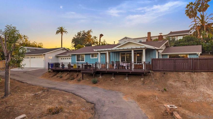 This beautifully updated single-level home in the desirable Rancho San Diego area of El Cajon offers a RARE FIVE-CAR garage setup, perfect for car enthusiasts or those in need of ample storage and workspace. It includes an attached 2-car garage and a custom-built 3-car garage with high ceilings that can accommodate tandem parking for certain vehicles. The garage also features a tankless water heater, adding to the home’s modern conveniences. The home offers 3 bedrooms, 2 bathrooms, and 1,866 square feet of living space on a peaceful hillside lot. The home sits on a usable half-acre and features a resurfaced pool with a new pump in a private, fenced-in area with synthetic turf—ideal for relaxing or entertaining, with direct access from the home. Inside, the kitchen has been fully remodeled with soft-close custom cabinetry, stainless steel appliances, a built-in wine fridge, and a coffee bar. There are two separate living areas, each with its own fireplace, creating flexible and comfortable spaces. Additional updates include high-end dual-pane windows, a newer HVAC system, and a FULLY PAID 20-PANEL SOLAR SYTEM for energy efficiency. The exterior has been treated with a $30,000 “Cool Wall” energy-efficient paint system. There’s also a private driveway, RV parking, and three additional storage sheds. The property includes mature fruit trees and plenty of open space, offering peace and quiet in a highly sought-after neighborhood. Laundry hookups are available both inside the home and in the garage.