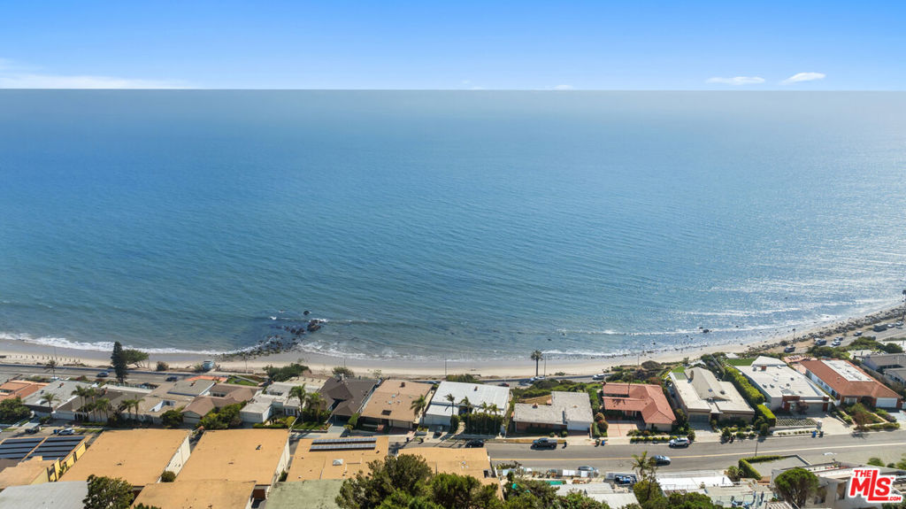 With stunning ocean views from nearly every room, this beautiful coastal condo is located in the highly desirable Sunset Mesa neighborhood. The main living room features sweeping Pacific vistas and opens to a spacious balcony, perfect for relaxing or entertaining. A dedicated dining area with more spectacular views leads into the recently remodeled kitchen, which includes quartz countertops, brand-new stainless-steel appliances, and custom cabinetry. The guest bedroom is spacious and bright, accompanied by an updated bathroom with a large soaking tub. The primary suite offers a continuation of views along the coastline, with a private balcony overlooking the iconic Queen's Necklace and a tastefully updated ensuite bathroom with a dual vanity. Designed to maximize the breathtaking surroundings, this condo includes new windows and sliding glass doors, enhancing the coastal lifestyle in Sunset Mesa. Additional amenities include in-unit laundry, two parking spaces, ample guest parking, and low HOA dues covering earthquake insurance, water, sewer, and trash. Just minutes from Palisades Village and the Getty Villa, this condo offers the perfect blend of convenience and serene beach living.