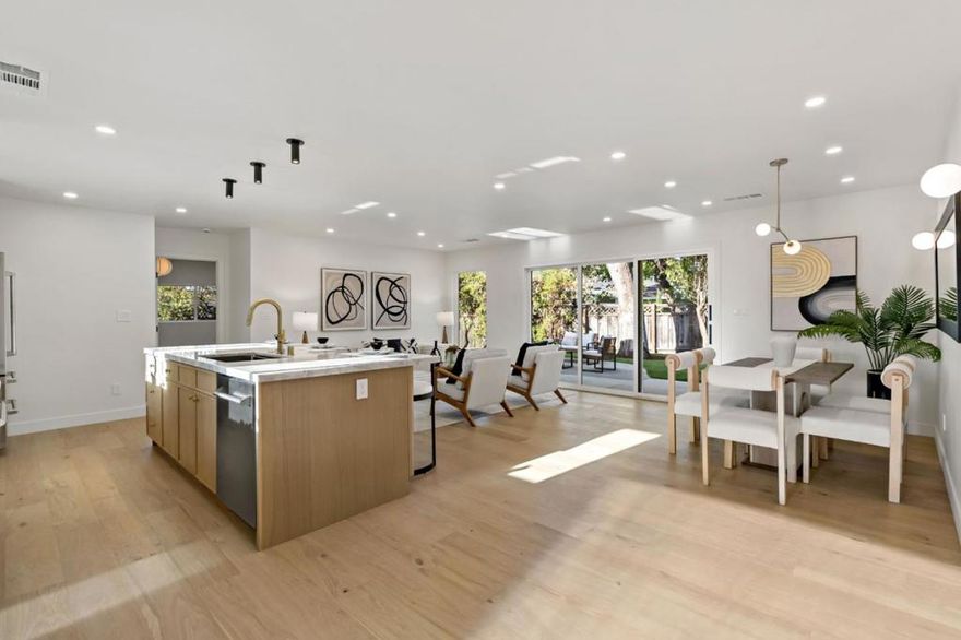 Fully remodeled contemporary single-story home in desirable Campbell! This 5BR/3BA residence offers 1,693 sq. ft. of open living space on a huge 12,412 sq. ft. lot with a detached 2-car garage. Featuring two master suites, a sleek open-concept kitchen with beautiful island and high-end finishes, top of the line appliances. Modern bathrooms with all new tile and Vanities. Wide-Hardwood flooring throughout. Expansive new windows fill the home with natural light and create seamless indoor/outdoor flow to the spacious backyard perfect for entertaining or future expansion (ADU potential, buyer to verify). Located near top-rated schools, parks, and shopping, with easy access to Hwy 17, 85 & 880. A rare move-in-ready contemporary gem on an oversized lot in one of Campbells most sought-after neighborhoods! Remodel includes rewire,New Plumbing,New Floor, New drywall, New Exterior/Interiors doors, All new plumbing fixtures, New Kitchen Counter top and Cabinets , All new electric fixtures, new Landscape and hardscape.