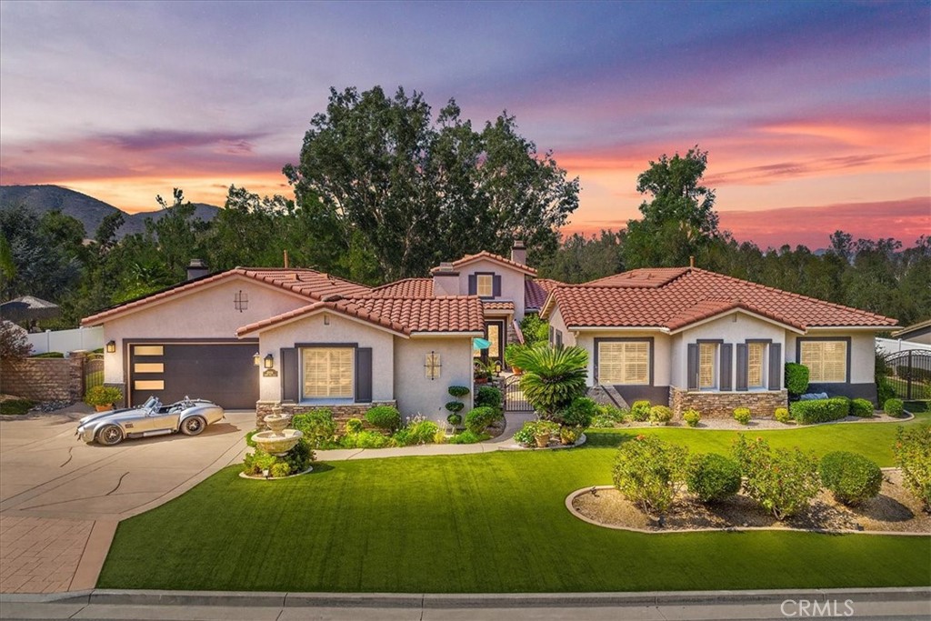 Welcome to 42926 Joshua Tree Court – where luxury, and lifestyle meet. This stunning single-story home sits on a premium lot in the highly sought-after gated community of Olive Hill Ranch Estates in Murrieta’s quiet west side. Tucked away in a peaceful cul-de-sac, the property offers incredible views of surrounding mountains and a sense of seclusion.
You will enter through a lovely courtyard with an outdoor fireplace and through beautiful iron and glass double doors. Inside, you will be delighted with the open floor plan that is designed for both comfort and functionality.
The heart of the home is the spacious great room with a chef’s kitchen, perfect for entertaining and everyday convenience. This well-appointed kitchen features granite countertops, stainles steel appliances, built-in fridge, a large center island, a walk-in pantry, a butler’s pantry, and insta hot water.
Additional features include a formal dining rooom, living roon, den, laundry room, mud room with courtyard and garage access, and a museum-quality 3-car garage outfitted with custom cabinetry and durable coated floors. The home is also energy-efficient with 32 fully owned solar panels.
The primary suite opens to its own patio where you can enjoy some quite time. The primary bath has a large soaking tub and spacious walk-in shower. One of the secondary bedrooms has a full bathroom attached.
Step outside to your private backyard retreat with a large, covered patio and deck extension, dual ceiling fans, built-in misting system, fire pit, above-ground spa, built-in BBQ kitchen, and outdoor TV setup—perfect for morning coffee, summer nights, parties, and Sunday football gatherings.
Outdoor enthusiasts will appreciate the nearby Santa Rosa Plateau with trails for hiking or mountain bike riding. Additionally, there is a nearby equestrian center to board your horse or keep in on your property in the expansive lower area. Good times are to be had at nearby Old Town Murrieta and Temecula’s world-class wineries.
This home is more than just a place to live—it’s a lifestyle. Come see for yourself why 42926 Joshua Tree Court is truly one of a kind.