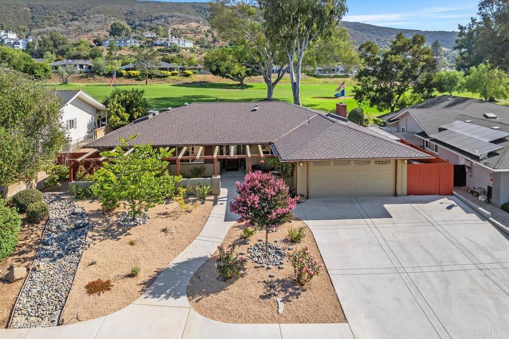 Welcome to this beautifully redesigned single-level home, nestled at the end of a peaceful cul-de-sac in the highly desirable Lake San Marcos community. Backing directly onto the golf course, this amazing retreat offers luxurious living with panoramic views and ultimate privacy. Inside, an open-concept layout connects the living, dining, and kitchen areas—perfect for everyday living or entertaining. The spacious living room is warm and inviting, featuring a cozy fireplace, recessed lighting, and abundant natural light from skylights and solar tubes. The chef’s kitchen impresses with custom cabinetry, a walk-in pantry, premium “Fusion” quartzite countertops, and a large center island. The bathrooms have been upgraded to spa-quality standards, with the primary suite offering a jetted tub and walk-in shower. Step outside to a covered patio with a serene fountain and sweeping golf course views—your private outdoor oasis. Additional upgrades include a recently installed roof with extended warranty, a 200 AMP electrical panel, in-house vacuum system, newer HVAC, water softener, and your own putting green and room for a swimming pool!!. Enjoy access to Lake San Marcos amenities—golf, tennis, boating, dining, and scenic trails. This rare single-story gem combines comfort, style, and location. THIS IS THE HOME YOU HAVE BEEN LOOKING FOR AND DESERVE!!