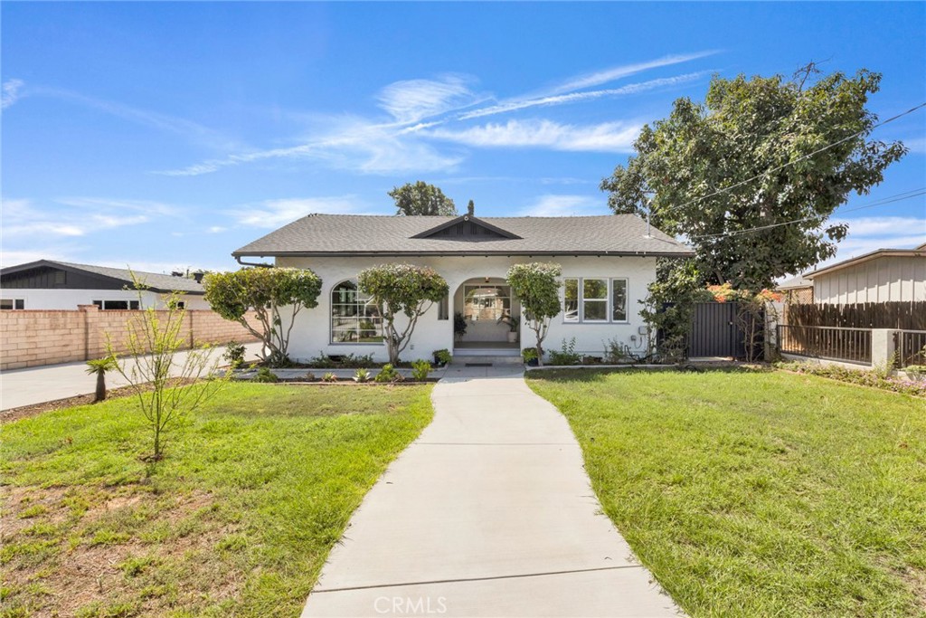 Nestled on an expansive 10,624 sf lot in a peaceful cul-de-sac, this exquisitely renovated 2-bedroom, 2-bathroom bungalow in Lower Temple City blends 1,220 sf of modern sophistication with timeless character. Recently transformed, the main house retains its original hardwood floors, adding warmth and elegance, while thoughtful upgrades elevate the living experience. New energy-efficient windows bathe the bright living room in natural light, creating an inviting ambiance. The cozy dining area seamlessly connects to the kitchen. Both bedrooms now feature newly added closets for ample storage, and the fully remodeled bathroom in the house boasts updated plumbing and contemporary finishes. New mini-split AC units ensure year-round comfort.The recently updated detached garage, with a new roof, built-in closet, and the second modern bathroom, offers versatile potential as a home office, guest suite, or ADU. The expansive lot, enhanced by newly added concrete surrounding the home, along with a gate and fencing for added privacy and security, invites endless possibilities for outdoor entertaining, gardening, or future expansion. The spacious side patio enhances the outdoor experience, perfect for relaxing or hosting gatherings.Tucked in a serene setting just minutes from Live Oak Park, shops, restaurants, and major freeways, this move-in-ready bungalow balances tranquil living with urban convenience.