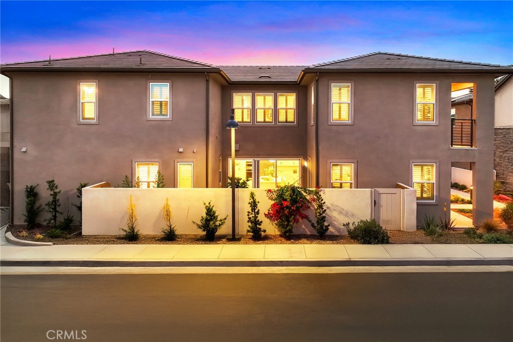 Located in the highly desirable Great Park community, this stunning Lennar home offers exceptional comfort and convenience. Just a short walk about 3 minutes from both Portola High School and Solis Park Elementary, it's perfect for families. The first floor features a full guest suite complete with a walk-in closet and private bathroom. Upstairs, you'll find a spacious loft ideal for family gatherings, along with a luxurious master suite boasting a high-end bathroom. Two additional bedrooms each have their own private bathrooms, providing ample space and privacy for everyone.