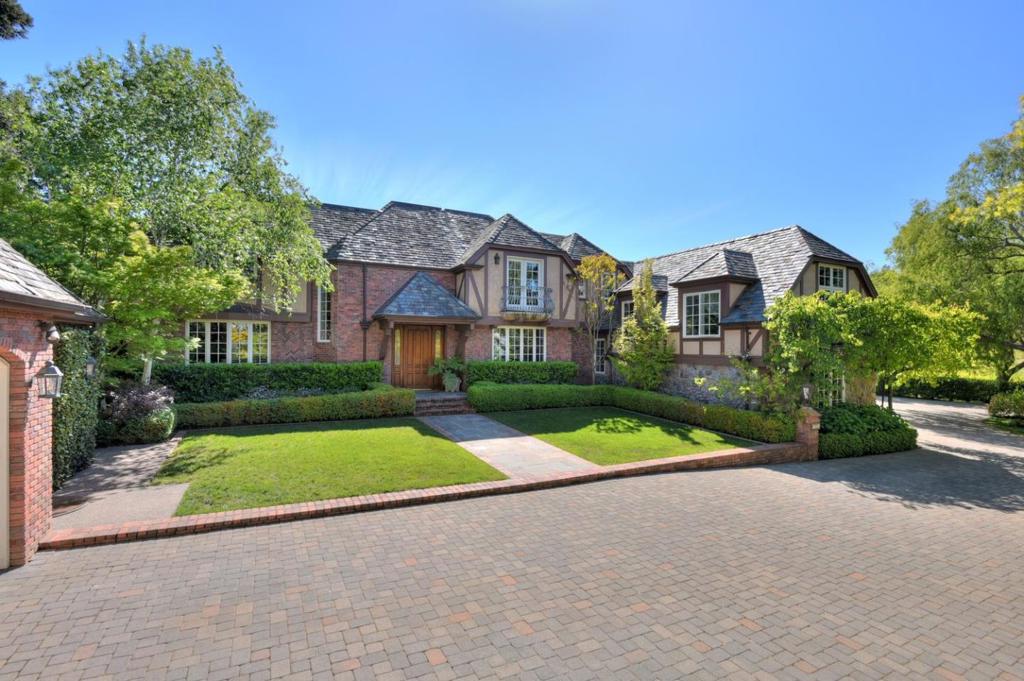 Elegant, custom, country English estate 3 blocks from the Village. Unbelievable quality throughout. Patterned hardwood floors, dramatic entrance staircase, architecturally interesting ceilings and lighting. French doors to lush garden, pool spa, outdoor kitchen and cabana with full bath. Workout room with 1/2 bath. Two 2-car garages. Perfect for both family living and gracious entertaining.