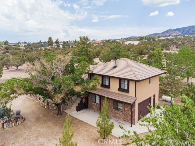 Welcome to Upgraded Home with Mountain Views! This 3-bedroom, 2.5-bathroom home offers a smartly designed living space and a rare floorplan that blends comfort, function, and charm. This home is turnkey and features a stunning, beautiful kitchen with wood cabinets, granite countertops, and top-of-the-line stainless steel appliances. The formal living room welcomes you with vaulted ceilings, a cozy fireplace, new central conditioning and one split system in the living room, and direct access to the private patio—perfect for morning coffee or evening gatherings. A separate family room offers a second comfortable living space and a seamless indoor-outdoor connection. A convenient downstairs half bath, laundry room, and direct access to the spacious 2-car garage. Upstairs, the primary suite offers vaulted ceilings, abundant space, perfect for enjoying calm mornings or serene sunsets. The en-suite bathroom features dual vanities, contemporary fixtures, and a relaxing soaking tub/shower combo. New flooring throughout is laminate on the second floor.
Upgrade the electrical panel to 200A. Owns 250 halon gas tanks. New septic tank. New 30/60. Dogs Cage.Irrigation system deep draining. All 2.28 acres are fully fenced.
BONUS: Detached 3-car garage converted to a gym and recreation room with a separate 100A new electrical panel, new water heater, full bathroom, and breakfast area. Also included new condition heat/cool, internet line, and owns 250 halon separate gas tank, new separate septic tank, and has a separate entrance to that place.
Pinon Rd with no neighbors above and privacy all around, this one-of-a-kind home offers breathtaking panoramic views.
This is more than a home—it's a lifestyle in your own private world.