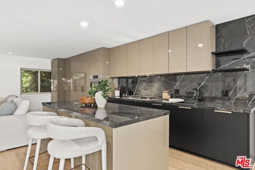 Welcome home to your Palm Springs like resort in the heart of West Hollywood. This beautifully renovated two-bedroom, two-bath residence features a reimagined Poggenpohl kitchen with new cabinets, appliances, countertop, backsplash, and a spacious kitchen island, complemented by a new Miele dishwasher and Bosch appliances. Brand new interior doors, new flooring, a new front door, upgraded recessed lighting throughout,  and remote operated custom made blinds elevate the home's modern appeal. The residence is further enhanced with a new Renewal by Andersen sliding door, and new windows and screens, filling the space with natural light. Positioned in the quiet rear of the complex, the living area and patio overlook the sparkling pool, while the primary bedroom offers a serene retreat tucked away for ultimate privacy. Just one block to Trader Joe's and the neighborhood pharmacy, and two blocks to Bristol Farms and Whole Foods, you'll enjoy unmatched convenience. Local favorites such as Laurel Hardware, Tu Madre, and Connie & Ted's are all just moments away, along with the vibrant restaurants and nightlife that define West Hollywood living. Set within a classic mid-century building, residents are welcomed by a striking terrazzo-tiled entry and can indulge in the resort-style pool and lounge area, complete with swaying palm trees, chaise lounges, and umbrellas, the perfect blend of style and relaxation.