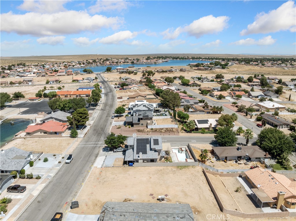 In 2024 Niche, mentions that Helendale is the #4 BEST Pace to buy a house, and it is to this day. Same is true for Vacant Land, with all the "off site" improvements already completed. All utilities are underground and in the middle of the street for this amazing 26701 Blue Water Rd level lot that offers exceptional opportunity to create your dream haven. Providing access to a wealth of amenities such as championship 27 hole gold course, prime fishing locations, equestrian for your horses, RV storage and RV Park, 2-Lakes 2-Beaches, Tennis Courts, Olympic size swimming pool and more recreational amenities for you to enjoy. Parks, Places of Worship, Convenient Shipping, Schools, and just 15-miles to the I-15 where you can find a plethora of major shopping experiences. Come home to Silver Lakes and be part of our Island Community. Professional Pictures to follow.