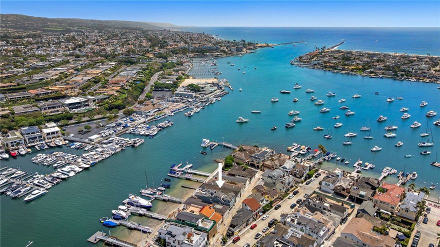 LEGACY BAYFRONT PROPERTY ON LITTLE BALBOA ISLAND. 117 E. Bay Front presents a rare opportunity to own a piece of Newport Beach’s most iconic waterfront. Situated steps from the nexus of East and South Bay Front, known to locals as “Crab Point”, this traditional two-story home captures sweeping views of Newport harbor yacht channel and the Newport harbor entrance.  With nearly 2,800 square feet of living space, savor breathtaking views from the first floor living and dining rooms, kitchen, and the large front brick patio perfect for entertaining, alfresco dining or simply relaxing. Upstairs, more front-row harbor views await from the spacious primary suite with fireplace, large sitting room, and over-sized private brick balcony. The main level includes two additional bedrooms and two baths, along with direct access to a two-car garage. The upper floor also features two more bedrooms—one or both of which can be closed off to create a private guest quarters complete with a wood-paneled living room, second kitchen, and dedicated exterior stairs. An included mooring complete with 18’ Boston Whaler runabout is accessed by the sandy beach located directly in front of the home and provides easy access to the ocean and harbor cruising. Located just a short stroll to Balboa Island, the Balboa Island Ferry and Marine Avenue’s charming boutiques and restaurants, this home offers the quintessential Little Balboa Island location and lifestyle. Now ready for its next steward,  don’t miss this once-in-a-generation opportunity to own a legacy property in one of Southern California’s most treasured coastal communities.