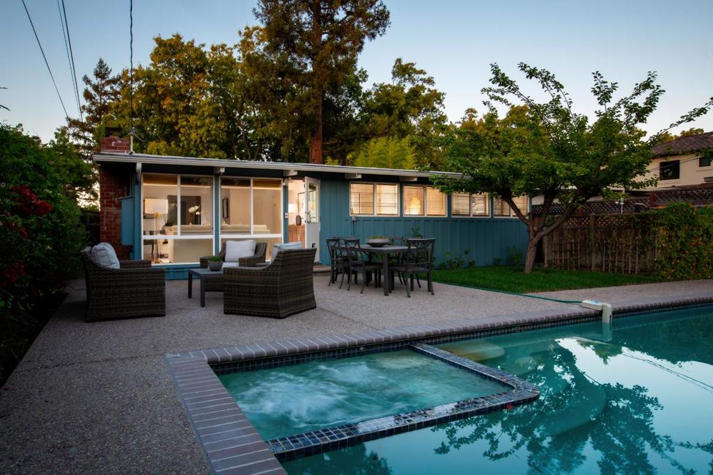 This Eichler-style home combines fresh updates with authentic mid-century character, highlighted by vaulted beamed ceilings and expansive windows framing the pool and lush gardens. Newly painted inside and out and with refinished hardwood floors, the home also features an updated kitchen and baths, operable skylights, and a fireplace in the central living and dining room. Refreshed landscaping surrounds the home where a pool and spa highlight the private rear yard, a lawn area is perfect for play, and hummingbirds enjoy the colorful blooms. Other recent upgrades include a newer roof and dual-pane windows, adding to the ease and comfort of living in this special home. Just one block from Palo Alto's Bicycle Boulevard, two blocks from Mitchell Park, and minutes from acclaimed Palo Alto schools, this Midtown area home reflects timeless mid-century design with thoughtful updates for todays lifestyle and the opportunity to further transform into your dream home. El Carmelo Elementary; JLS Middle; Gunn High (buyer to confirm). (Please do not leave children unattended due to pool.)
