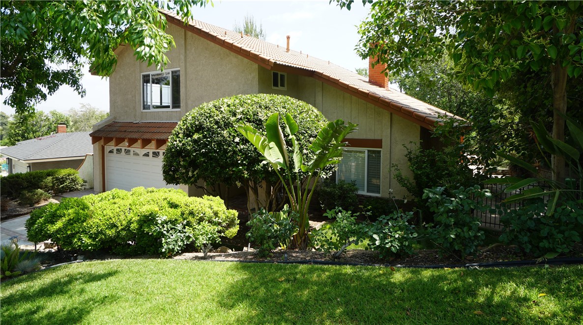 Fantastic view home with a private backyard designed for entertaining located on a quiet cul-de-sac.
An entertainer’s dream. Upon entering the tile entryway, you will find the formal living room featuring a vaulted ceiling, recessed lighting, and oak flooring. A massive two-sided stone fireplace with a wet bar separates the living room from the family room. The family room side of the fireplace showcases beautiful used brick and is near the entrance to the wet bar. The family room also boasts a tall, vaulted ceiling, recessed lighting, and oak flooring. From the family room, enter the formal dining room through a large archway entrance, with French doors leading to the magnificent backyard. A large, covered patio features an outdoor kitchen equipped with a built-in barbeque, refrigerator, sink, and storage cabinet, all of which are stainless steel. There is ample counter space and a ceiling fan. A gas firepit is on the opposite side. Beyond the covered patio lies a gray bottom pool and spa, surrounded by elegant stone trim and lush green privacy. Behind the pool is a large deck, providing additional entertainment space and offering a splendid location to enjoy stunning sunsets. The spacious eat-in kitchen includes stainless-steel appliances and a stainless-steel sink with a window overlooking the scenic backyard. The laundry room comes with an included front-load washer and dryer. The downstairs area features a half bath with a granite top vanity and tile flooring. There is abundant storage space, including a large coat closet and substantial under-staircase storage.
Ascending the newly carpeted staircase with oak railings, you will find four bedrooms. To the left, the expansive master bedroom, featuring two large windows with a view of the front of the property and the other offering a panoramic view of the valley. The master suite includes a spacious walk-in closet and a master bathroom with a tile floor, double sinks, and a large stall shower with frameless glass. The other three bedrooms also offer picturesque views. The hall bathroom includes tile floors, a shower over the bathtub and dual sinks. The entire upstairs features new carpeting, and the home has been freshly painted inside both upstairs and downstairs.
This remarkable home is being offered for the first time by the original owners who have meticulously maintained this family treasure. Do not miss the opportunity to create your own family memories in this exceptional property.