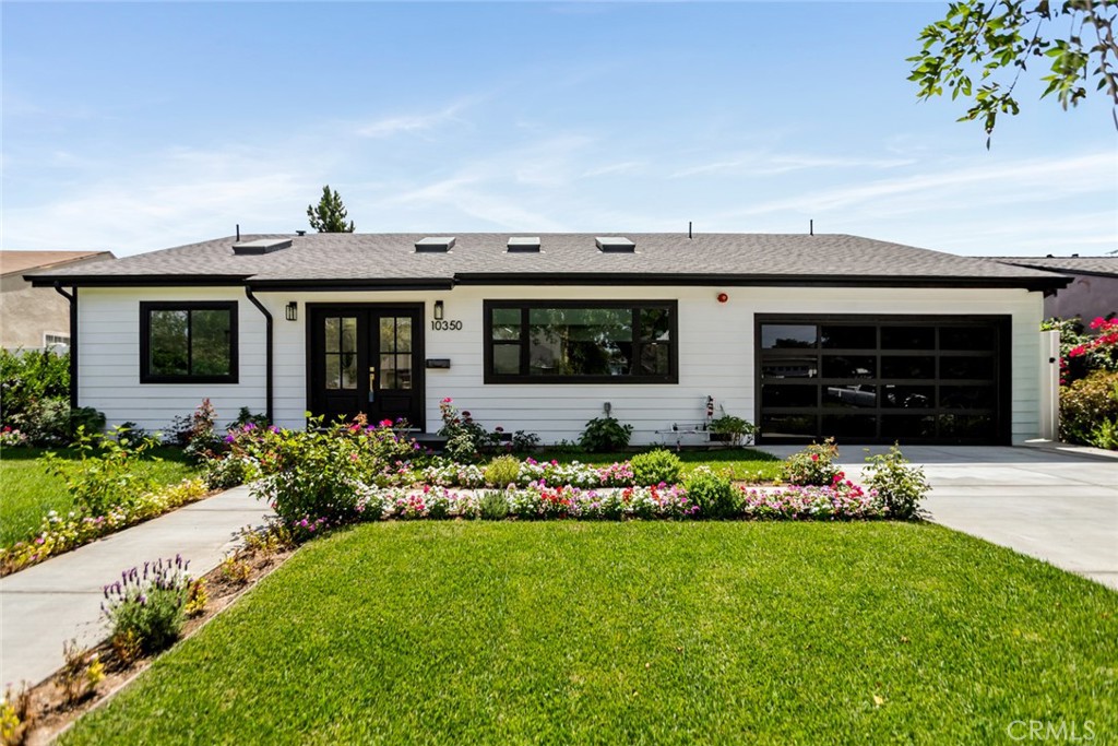 Step into this brand-new remodel in Toluca Terrace offering 4 bedrooms, 5 bathrooms, and 2,669 sq ft of living space on an expansive 8,433 sq ft flat lot. Impeccably designed with an open floor plan, vaulted ceilings, and skylights throughout, the home is filled with natural light and modern sophistication. The chef’s kitchen showcases dolomite quartz countertops, custom chestnut cabinetry, and top-of-the-line appliances including a Kucht range, Bosch dishwasher, and LG washer/dryer, all while blending style, efficiency, and reliability. White oak wood floors run throughout, complementing the home’s warm, contemporary aesthetic, complete with an attached 2 car garage. Each bedroom includes an ensuite bath with automatic toilets and walk-in closets, with multiple access points leading to the beautifully landscaped backyard. Unique features include a Dutch-style entry door, exceptional finishes, and a rare oversized private lot with room to add a pool, ADU, or both.
Conveniently tucked away in desirable Toluca Terrace, this home is just moments from the Chandler Bike Path, Magnolia Park’s cafés and boutiques, Porto’s Bakery, and top-rated schools—all with striking mountain views in the San Fernando Valley. A rare Toluca Terrace gem, just waiting for you to write your greatest chapter.