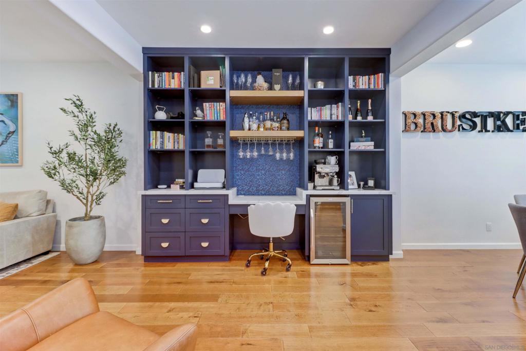 This impeccable renovated townhome is nestled in the heart of Mission Valley, offering a seamless blend of modern design and comfort within a beautifully maintained, gated community. The community itself features charming street pavers, a serene pool and spa with inviting lounge seating, and private access to the scenic Mission Valley River Trail and the San Diego River. Inside, the home boasts an array of impressive features, including Quartz Stellar White countertops, a Lupano glass subway tile backsplash, a spacious walk-in kitchen pantry, and top-of-the-line KitchenAid stainless steel appliances. Sunlight fills the home through vinyl windows adorned with plantation shutters, illuminating the warm wood flooring, built-in family room bookshelf and desk, and the stone-veneered fireplace with a self-starting log insert. Enjoy quiet moments on the private, elevated sitting porch or in the generous two-car garage, which offers additional space perfect for storage or a home gym. The recently remodeled primary bathroom is a true retreat, featuring Durango Cream Splitface shower tiling, Tuscany ivory floor tiles, a seamless glass shower with a rain shower head, raised sinks with matte black hardware, a luxurious soaking tub, and a bidet. Conveniently located near “The Valley” mall, the San Diego Trolley Station, Pacific and Ocean Beaches, downtown San Diego, and a variety of local attractions, restaurants, and coffee shops. This home offers the perfect balance of private, tranquil living and vibrant urban lifestyle.
