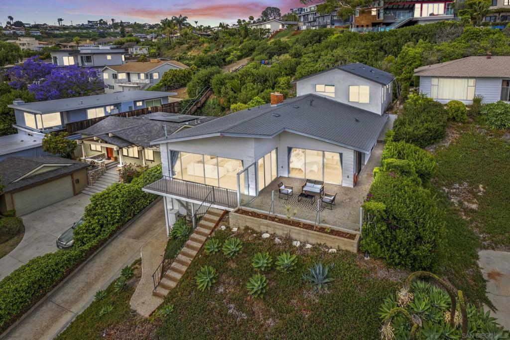Welcome to 5021 Foothill Blvd, an exceptional Pacific Beach property with a new ADU that perfectly blends coastal charm with modern luxury. Perched above the coastline, this beautifully updated residence offers breathtaking ocean views and an incredible opportunity for multi-generational living or additional income. The main home features 2 spacious bedrooms and 2 elegant bathrooms, thoughtfully designed with updated finishes, an open-concept living space, and expansive windows that flood the home with natural light and coastal breezes. Just completed, the brand-new ADU boasts 2 additional bedrooms and 1 bathroom, also showcasing stunning ocean views, modern amenities, and a private entrance, ideal for guests, extended family, or lucrative rental income. Step outside to enjoy the sun-soaked patios and balconies and take in the panoramic views that make this Pacific Beach location so desirable. Whether you’re enjoying morning coffee with ocean breezes or hosting sunset gatherings, this home was made for elevated coastal living. The seller has never occupied the property and has very limited knowledge of property condition or history. All measurements are approximate. Buyer's and Buyer's Broker/Agent should verify measurements and complete thorough inspections and investigations prior to Close of Escrow to satisfy themselves with the current condition of the property. Buyer(s) to verify and approve all data, reports, records, inspections, permits, MLS, HOA, if applicable and all information pertaining to the property prior to removal of contingencies. All contracts/offers are subject to seller approval and any offers or counteroffers by seller are not binding unless the entire agreement is ratified by all parties.
