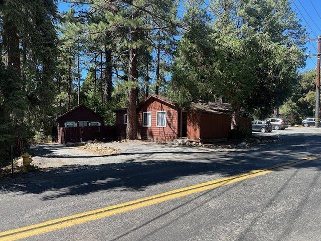 Exceptional investment opportunity in the heart of Idyllwild-this unique offering consists of four parcels totaling over 1.5 acres, featuring 14 fully occupied rental units that range from efficient studios up to spacious four-bedroom homes. The rear of the property borders the tranquil creek, providing select units with peaceful water views and a serene natural backdrop. Tenants pay their own utilities, and there is ample parking for residents and guests alike. The property is on town sewer and ideally located within walking distance to all local amenities, while generous open space offers potential for additional units. With a consistent occupancy history and strong income stream, this in-town, creekside property is a proven money maker and a rare chance to own a high-performing rental portfolio in one of Idyllwild's most desirable locations. cap rate of 7.19
