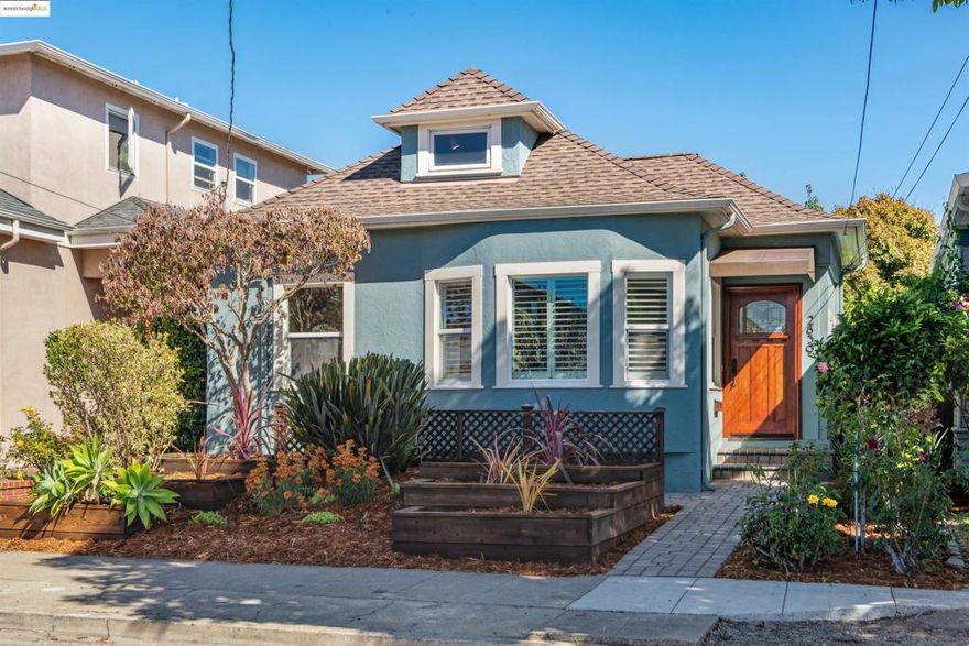 Saunter down this small fairytale street in Alameda’s coveted East End and you’ll come upon this artistic Craftsman bungalow: 2839 Washington Street.  Full of Craftsman details and creative touches, it just says “you’re home.”   A novel entry brings you to the  light-filled  living room, dining room with bay windows.  The primary and guest bedrooms open onto their own lush greenery.  The updated farmhouse kitchen says "come on in" with  its off white Shaker style cabinets, stone countertops and new appliances   That takes you to another rather big plus:  an upper floor “great room" with an extra 515 square feet of space to create your own art room, media room or office.  As for pluses  ... and added income  ... there's a fully oufited studio cottage with its own patio that previously rented for $1750 per month (ADU potential). And that's  all set in its good-sized yard with loads of room for gardens,  barbecues and friends around the firepit.