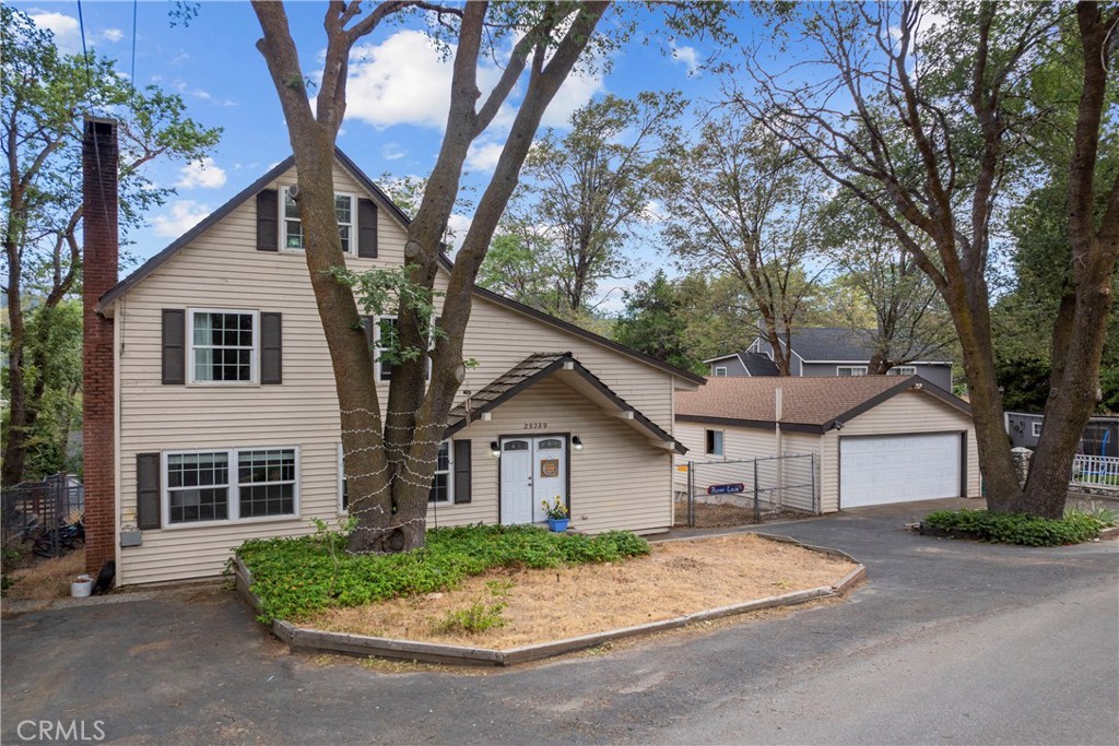 LEVEL FRONT & LEVEL BACK YARD. Big, sprawling “modern farmhouse” in adorable community of Cedar Glen has it all. On the coveted street of Lake View close to the famous “Malt Shop,” and The Glen shopping center arrive to a formidable property, on all level ground, that soars three levels under the canopy of a large oak. Step into a foyer and beyond into a two-story living room with cathedral ceilings and corner, floor-to-ceiling, lava rock fireplace. On the right, a bank of tall windows brings in natural light, and on the left, an open floor plan reveals the kitchen and dining nook separated by a large eat in bar, all nestled under whitewashed beams above. Sliders open out from the living area & kitchen onto a large NEW deck and huge, perfectly flat backyard. Adjacent is a large cozy den, and another fireplace framed on both sides with whitewashed book shelves the entire length of the room; and a powder room. _____________________Upstairs, a music loft can be seen from below that is connected to a large primary bedroom, another bedroom and a full bath. Travel a short flight of stairs where two smaller bedrooms are perfect for growing children. ____________________________ A short walk downstairs is an entire studio apartment that can be rented. The main room has a living/kitchenette (sink/counter/cabinets), bedroom area and ¾ bath; with separate entrance. Parking at the front of the house is for five cars and on large lot, adjacent to the home is a super-sized two car garage. WHOLE HOUSE GENERATOR