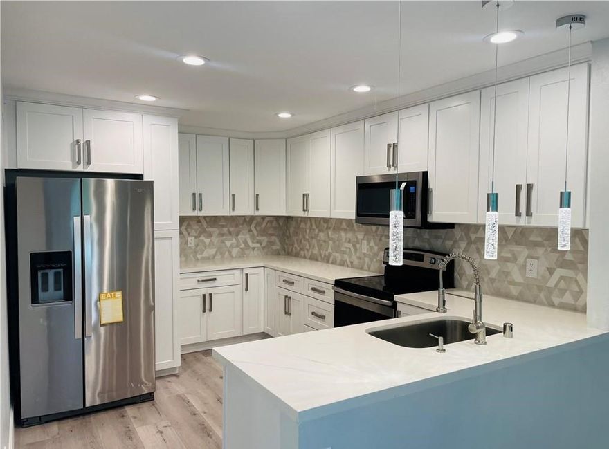 New beginning awaits you in this Spectacular Fully Upgraded property with an abundance of natural light that fills both levels. The open-concept kitchen flows into the dining room and living/family room areas leading to the private balcony. On the entry-level, you will find a bedroom, bathroom, laundry area, an eat-in kitchen, family room, view balcony, and even a skylight. Downstairs are 2 additional bedrooms, a bathroom and lots of storage. The two stories of space offer indoor-outdoor living on both levels with the upper deck and the lower patio. A perfect expression of timeless elegance highlighted by Recent paint, newer Kitchen, newer flooring throughout, newer bathrooms & vanities, recessed lighting, newer wall switches & outlets and so much more. Inside laundry completes the package. This townhome also includes a one-car garage, plus an additional enclosed contiguous parking space attached to the garage. This a beautiful tree-lined and park-like community. the day Laguna Village is a rare complex where the buildings have more space from each other than most other complexes in Orange County. It also offers a gym, tennis courts, pool, spa, playground, sand volleyball court, barbecues, and more! Short drive to the Irvine Spectrum, there is always something fun to do close by.