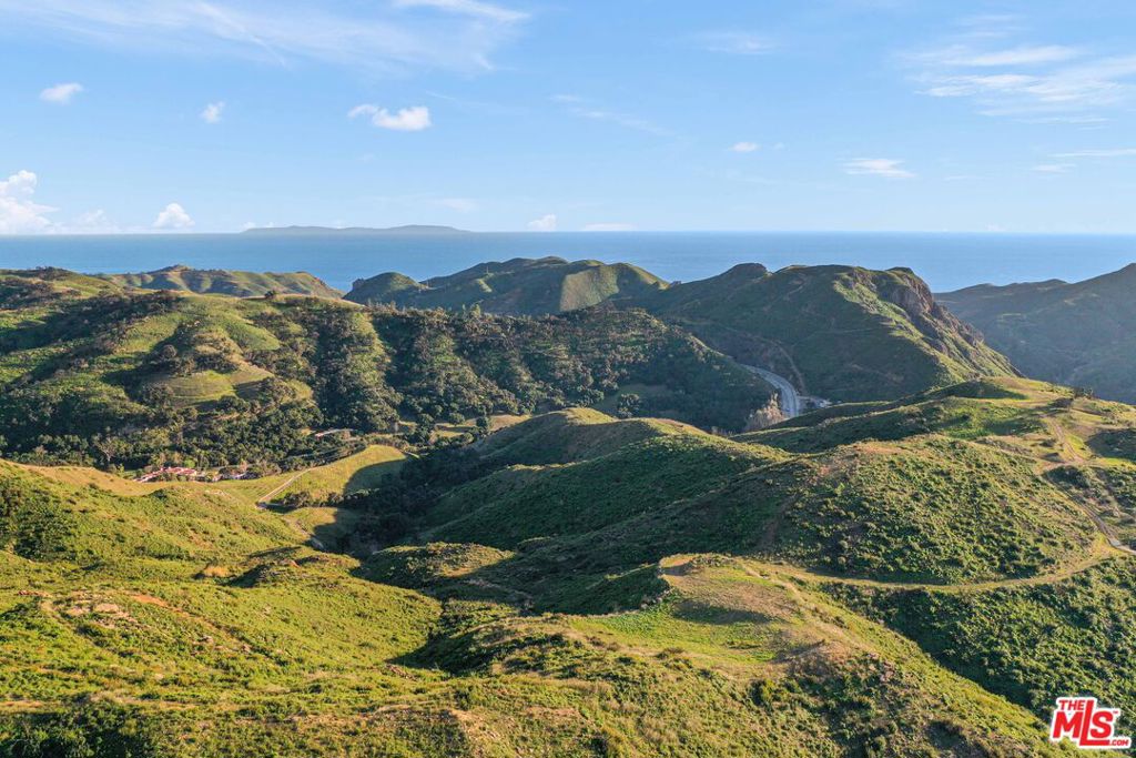 A rare and extraordinary opportunity awaits on three adjacent parcels totaling approximately 66 acres in the heart of Malibu. Situated in what is known as Malibu's Wine Country right after the first tunnel on Kanan Dume Road. Many of these grand estates serve as prestigious wineries and sought-after event venues, while others are secluded private ranches or luxury retreats. Notable vineyards such as Rosenthal, Saddlerock Ranch, Cielo Farms, and Rocky Oaks each represent a distinct facet of Malibu's rich wine-making tradition. This property offers unmatched privacy and sweeping, unobstructed views of the ocean, Queen's Necklace, Catalina Island, and the dramatic rock formations, including Turtle Rock. The land features expansive, level building pads ideal for two homes or a sprawling estate. Existing infrastructure includes two driveways from Kanan Dume Road, one partially paved and the other an easement along with a fire hydrant strategically positioned between the two potential building sites. Only 5 miles from Pacific Coast Highway, markets, sandy beaches and much more. This exceptional property offers the perfect blend of seclusion and accessibility, presenting a blank canvas for a truly unique and spectacular estate.
