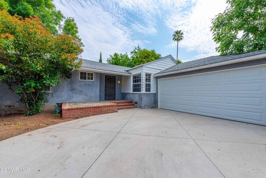 WOW! $80k price improvement!! The least expensive and ONLY single residence home available as of June 27 2025 in the heart of Tarzana! Charming Single-Story Bungalow in Prime Tarzana Location! Nestled on a peaceful, interior tree-lined street, this delightful 3-bedroom, 1-bath home offers timeless character and comfort in one of Tarzana's most desirable neighborhoods. Charming curb appeal framed by mature trees and an enchanting brick and stone porch. Step inside to discover warm wood floors, wood-beamed ceilings, and a cozy fireplace that anchor the living space with vintage charm. The home exudes ''old school'' character throughout, offering a rare blend of nostalgic style and modern potential. The private backyard is ideal for relaxing or entertaining and plenty of parking add to the property's convenience and value. Don't miss this wonderful opportunity to own a special home in a fantastic Tarzana location--close to shops, restaurants, and excellent schools, yet tucked away in a serene, residential setting.